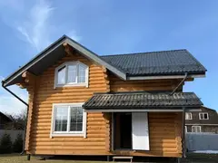 Жилые дома с мансардой из бревна срубов в марте 2026