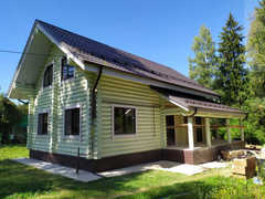 Дом из бревна оцилиндрованного с верандой