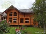 Загородный дом с мансардой из бревна #867